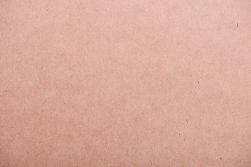 Brown textured cardboard background.