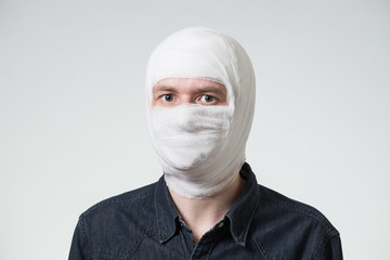Man with bandage on his head