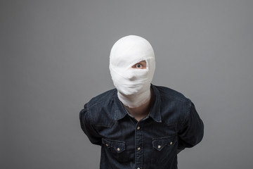 Man with bandage on his head