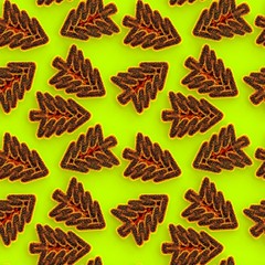 Seamless background of golden Christmas trees, green background