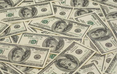 background of many hundred dollar bills
