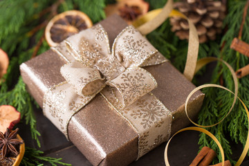 Christmas gift on the antique wooden background.