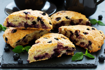 scones with oatmeal, blueberries and coconut. - obrazy, fototapety, plakaty