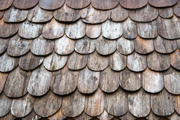 Wooden roof texture,background or wallpaper in the old traditional house roof or temple in Thailand
