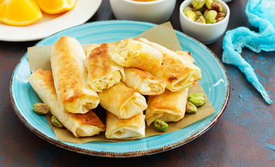 Fried rolls with dough filo and cheese curd cheese filling.