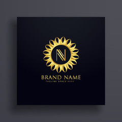 letter N premium logo concept design with golden decoration