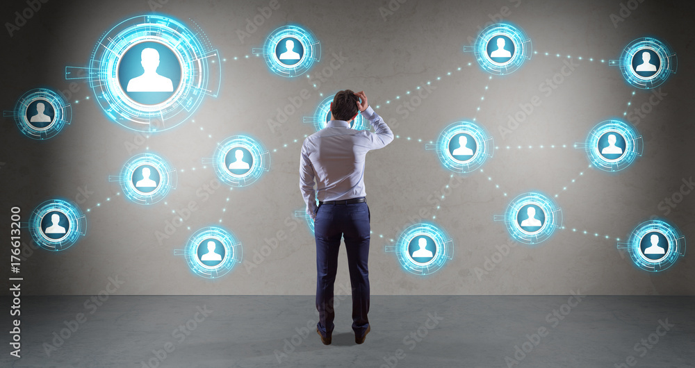 Poster Businessman using social network interface on a wall 3D rendering