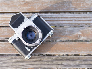 Retro camera, medium format on a wooden background