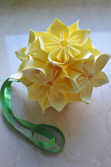 Kusudama morning glory-origami paper flowers on neutral background.