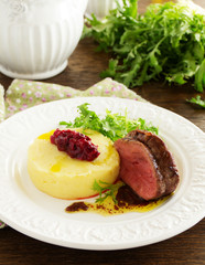 Roast veal with mashed potatoes and plum chutney.