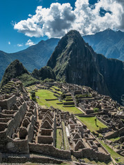 Machu Picchu citadel view with clouds - obrazy, fototapety, plakaty