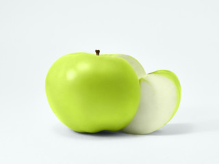 Isolated green apples Fresh granny smith Juicy green apple with a carved piece is lying on a white background Isolated fruit's photo