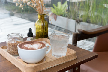 hot chocolate drink with heart latte art. delicious  cocoa beverage serve with flavor and brown sugar