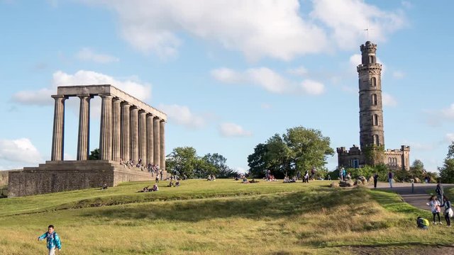 Timelapse of people passing by monuments