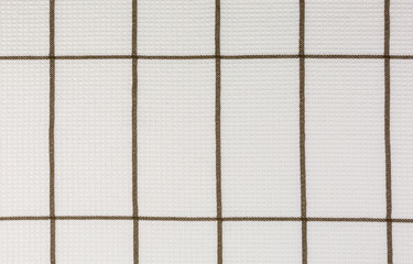 close-up of white and brown dish towel