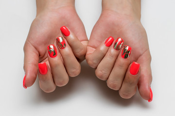 coral, red manicure on long square nails with gold foil inserts 