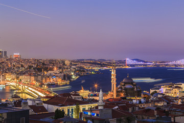 Fototapeta premium Istanbul view from down town of the city during the twilight with beatiful atmospheric blue sky and city lights