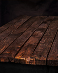 Dark wood table, brown wooden background