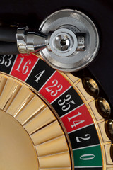 Stethoscope lies on the roulette wheel