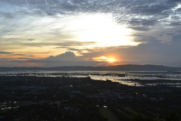 The view of the city in Myanmar during sunset as shot from Mandalay Hill