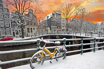 Fotobehang Snowy Amsterdam in the Netherlands in winter © Nataraj