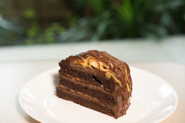 banana caramel chocolate cake. tasty delicious dessert on white plate. homemade bakery pastry