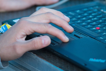 Senior man hand working on laptop notebook