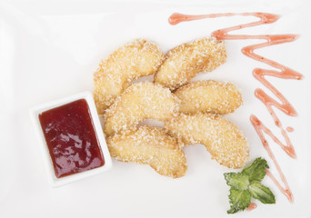 fried banana with raspberry jam on a white background with mint