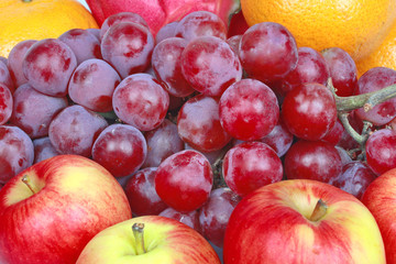 Mixed fruits as Red seedless grapes,orange,apple,Dragon fruit,Japanese golden melon.