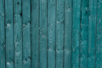 Dark green old wooden boards. Backgrounds and textures fence painted. Front view. Attract beautiful vintage background.