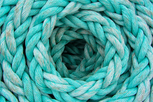 The light-blue rope is twisted by a ring, background, texture