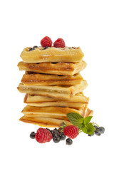 Stack of Belgian waffles with berry fruit