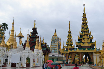 Fototapeta premium The national religious symbol of Burmese. It's the shwedagon Pagoda with its golden stupa, and many people visiting this place