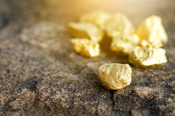 The pure gold ore found in the mine on a stone floor