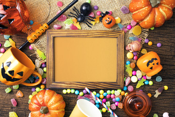 wood frame and candy dessert colorful in halloween concept