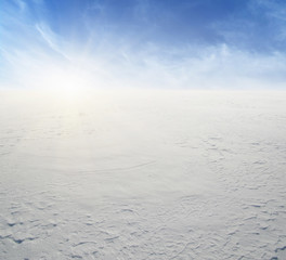  Snowcovered fields on blue sky