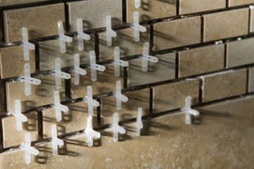 Tiling spacers inbetween mosaic tiles