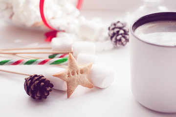Obraz na płótnie Canvas Christmas or New Year composition with hot coffee and marshmallows, decorated with sweets, cookies, ginger bread, number of 2018 year. Winter holidays background.