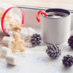 Having coffee at Christmas morning: cup of coffee and xmas sweets