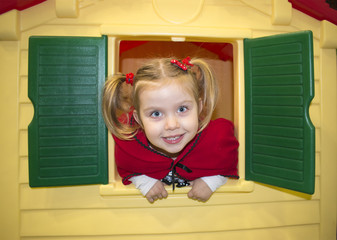 Cute blonde little girl wearing Red Riding Hood costume