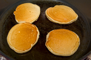 cooking four pancake on frying pan homemade