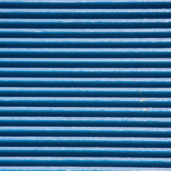 detail of blue shortcullis (rolling shutter), Santorini Greece.