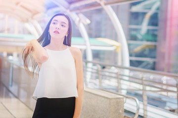 Attractive young women walking at street centre. Beautiful young mixed race caucasian / chinese asian shopper.