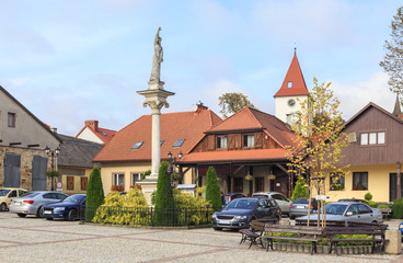 Lipnica Murowana, Poland. Market Square with St. Szymon of Lipnica Column and historic buildings