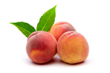 Peach with leaf isolated on white background