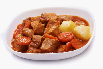 Goulash, beef stew with potatoes isolated on white background