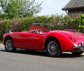 Sports car Oldtimer in red as a convertible