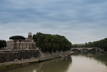 View of the old Roman city's historic buildings and decorated with a dome of a basilica on a gray cloudy day
