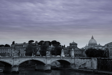 View of the old Roman city's historic buildings and decorated with a dome of a basilica on a gray cloudy day