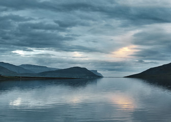 Travel to Iceland. beautiful cloudy sky over fjord in the north-west of Iceland, on the Westfirdir peninsula in Iceland.